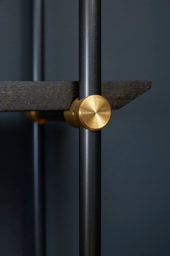 Brass fixing with dark timber